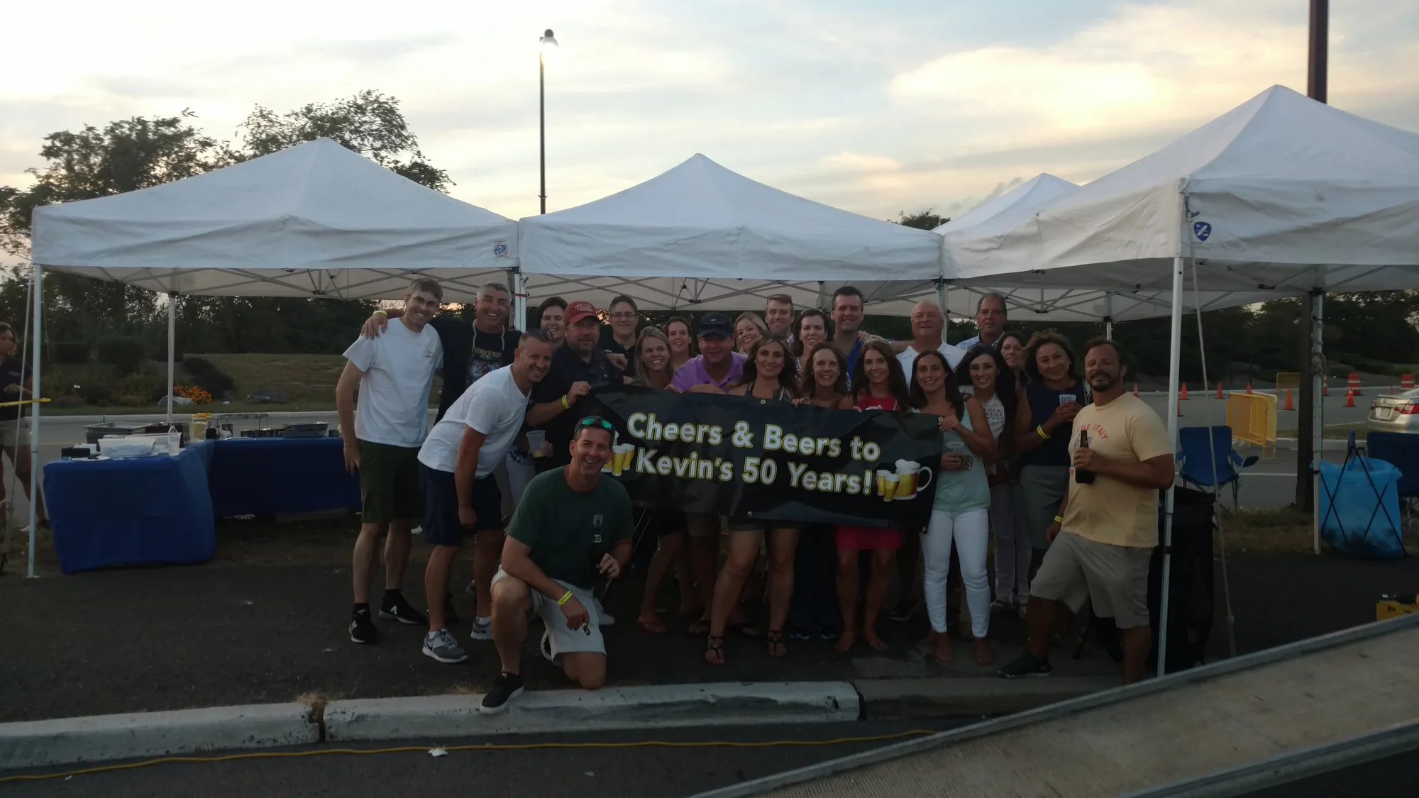 A big group gathered for a party under the tents