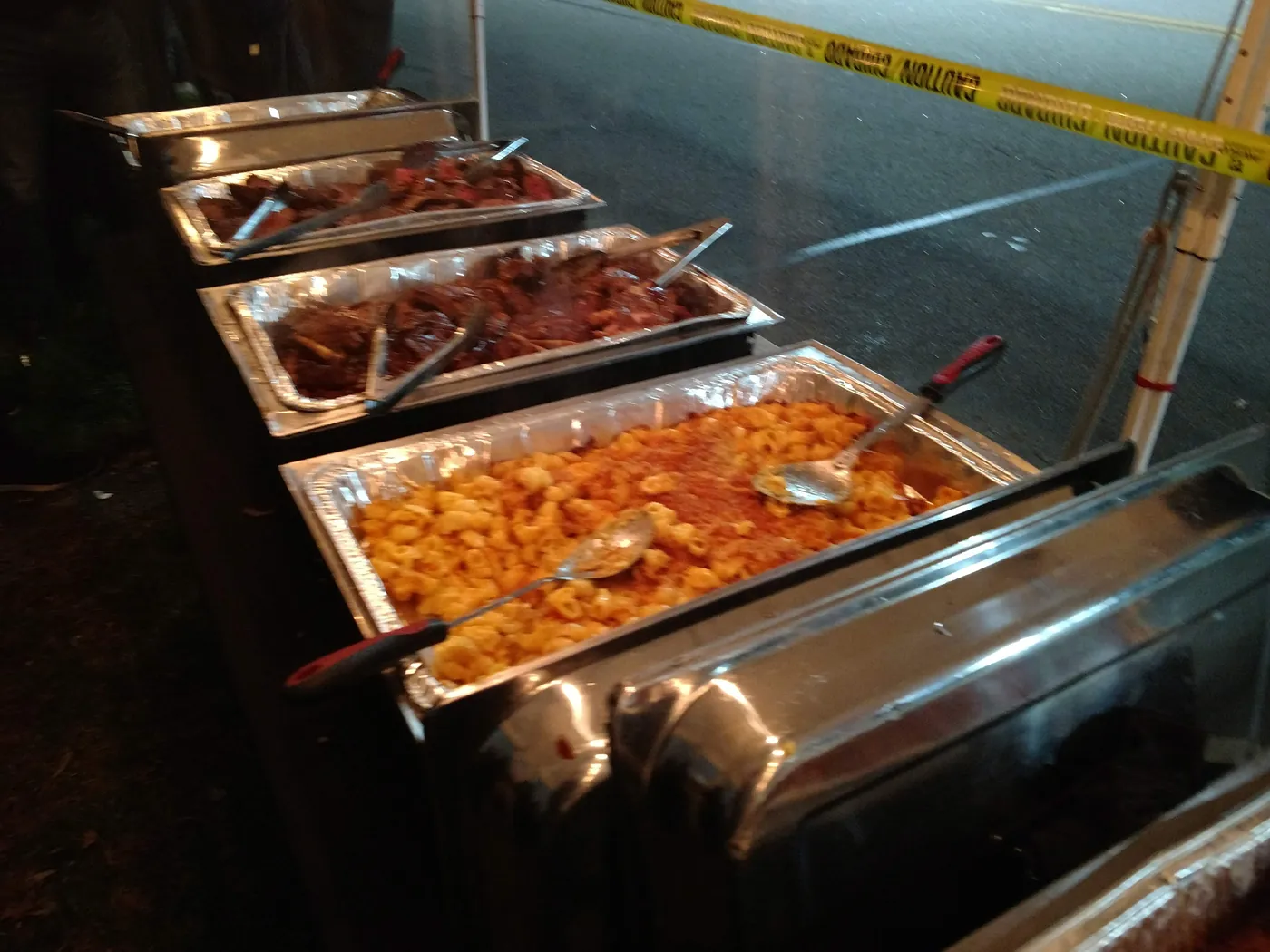 Trays of saucy wings and grilled food ready to serve